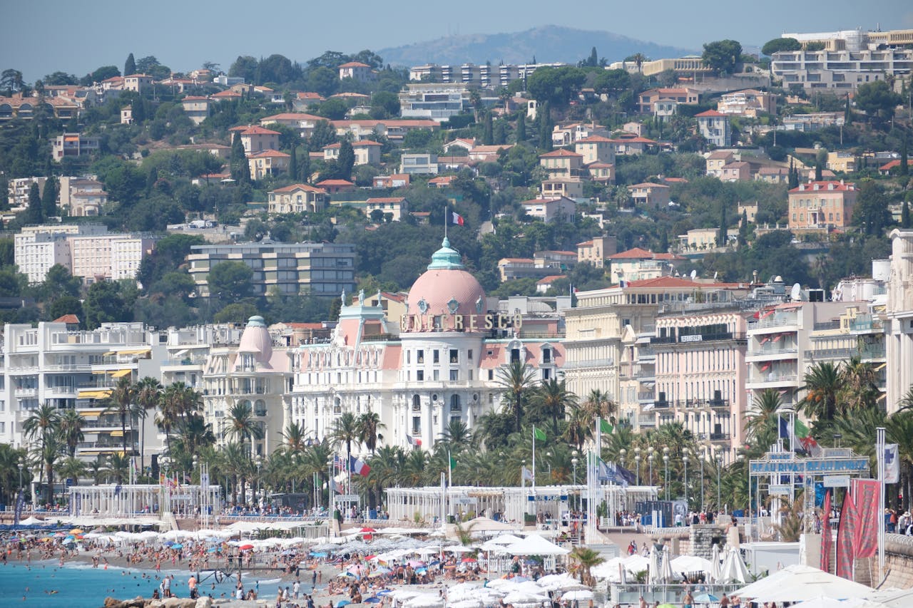 A beach with a lot of people and buildings